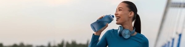 fit-european-woman-relaxing-drinking_wide